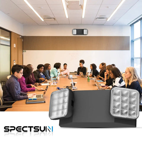 Modern conference room with 4 Pack Black LED Exit Signs With Battery Backup And Emergency Lights, adjustable 2 LED heads shown.