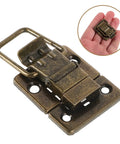 Vintage Antique Box Latch 2 Pack Iron Toggle Buckle Hardware for jewelry boxes, showing detailed iron latch and scale in hand.