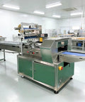 Smooth Operator Compact Horizontal Flow Pack Machine Small Shrink Wrapper displayed in a clean kitchen environment.