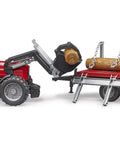 Massey Ferguson 7480 Tractor With Detachable Front Loader And Timber Trailer Set carrying tree trunks, demonstrating off-road ability.