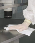 Boss Grade Polyester Clean Room Wipers Six By Six Inches One Fifty Piece Bundle For LCD PCB Maintenance and Stubborn Solvent Grime being used to clean a lab countertop.