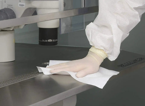 Boss Grade Polyester Clean Room Wipers Six By Six Inches One Fifty Piece Bundle For LCD PCB Maintenance and Stubborn Solvent Grime being used to clean a lab countertop.