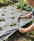 Using Heavy Duty Plastic Landscape Edging Spikes 100 Pack 8 Inch Spiral Anchoring Nails For Weed Barrier in a garden