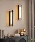 ElilyGiA 16 Inch Modern LED Wall Sconce Vanity Light, Black with ripple glass shades illuminating a modern living space.