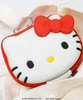 Close-up of Hello Kitty Nintendo Switch Cartridge Case Zip Storage Wallet shaped with red bow, on white fabric.