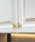 10 Pack Single Hole Brushed Antique Brass Cabinet Handles And Zinc Drawer Pulls For Kitchen Cabinets Cupboards Dressers And Wardrobes Rust Resistant Hardware With 2 Inch Overall Length And 0.58 Inch Diameter on white cupboard