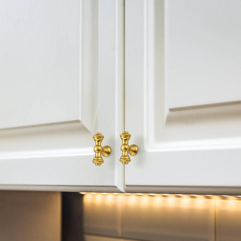 10 Pack Single Hole Brushed Antique Brass Cabinet Handles And Zinc Drawer Pulls For Kitchen Cabinets Cupboards Dressers And Wardrobes Rust Resistant Hardware With 2 Inch Overall Length And 0.58 Inch Diameter on white cupboard