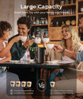 Four people sitting around a table using 8 In 1 Milk Frother And Steamer With 21oz Capacity Detachable Design Three Temperature Settings Electric Hot And Cold Foam Maker For Latte Cappuccino Barista Style And Hot Chocolate Works With Dairy And Plant Based Milks Dishwasher Safe in a cafe setting.