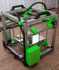 Built Tough Hypercube Evolution 3D Printer Metal Frame Kit With 300X300X300MM Square Build Volume showing green accents and aluminum structure.