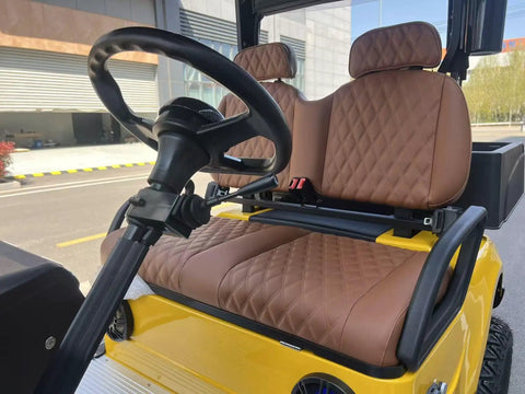 Interior view of Sweet 2 Seat Cargo Van Golf Cart with plush brown seats and steering wheel for comfortable drives.