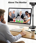 Telescopic Webcam Tripod Desk Mount With Phone Holder, Adjustable 11.4 To 18.7 Inches next to a desktop monitor with video call