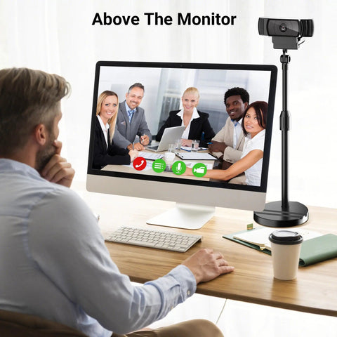 Telescopic Webcam Tripod Desk Mount With Phone Holder, Adjustable 11.4 To 18.7 Inches next to a desktop monitor with video call