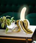 Banana Shaped Table Lamp With LED Night Light Modern Resin Banana Lighting Fixture with acrylic frosted shade on side table