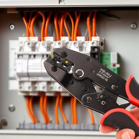 Killer Ratcheting Wire Crimper For 22-10 AWG Terminals in use on electrical connections with orange wires.