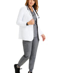 Woman wearing Womens White Lab Coat With Five Pockets Full Sleeve 5160 Flo Relaxed Fit Exam Coat For Medical Professionals Minimalist Collection