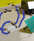 Pro Grade Soldering Station With Flexible T12 Arms And Weighted Base Soldering Holder For PCB Repair shown on a workbench