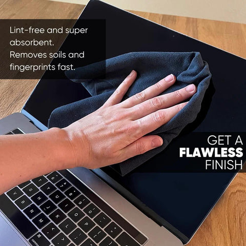 Front view of a gray microfiber lens cleaning cloth wiping a laptop screen (8x8 inches)