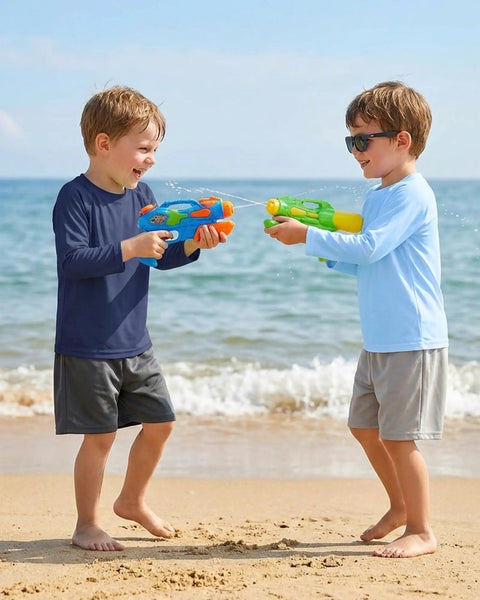 Two boys playing with water guns on beach wearing Toddler Rash Guard Swim Shirt For Boys Long Sleeve UPF 50+ Sun Safe Protection Navy Blue.