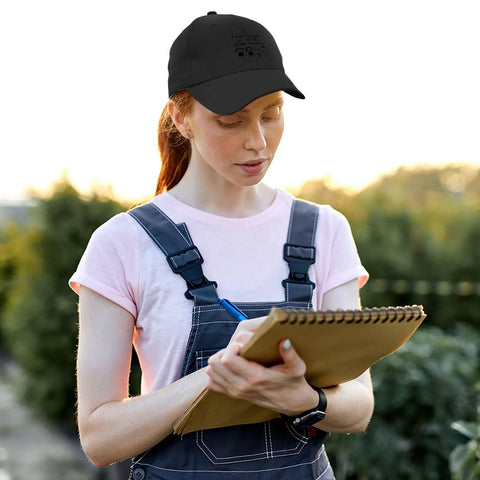 Person wearing lightweight adjustable cotton dad hat for men with relaxed fit breathable summer cap writing outdoors