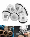 Close-up of six white check valves with springs and O-rings for AR Annovi Reverberi pressure washer pumps.