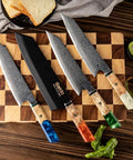 Kiritsuke Knife Cover With Walnut Magnetic Sheath For 10 Inch Blades on wooden cutting board with Damascus steel knives.