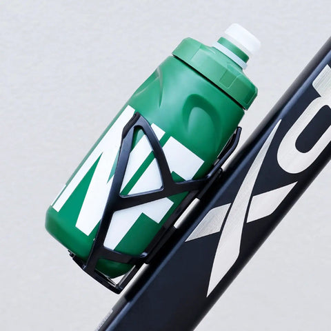 Green Leak Resistant Squeeze Lid Water Bottle for Biking and Hiking on bike frame, ergonomic grooves, detachable cap visible