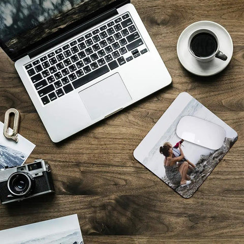 Custom Photo And Text Mouse Pad Neoprene Gaming Desk Mat on wooden desk with laptop and coffee cup
