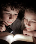 Children reading by Compact LED Mini Flashlight With Tiny But Mighty Brightness, Waterproof And Energy Efficient, Ultra Portable