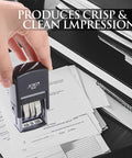 Self Inking Date Stamp Featuring Us Mmm Dd Yyyy Format And Crisp Black Prints For Fast Desk Jobs Or Teacher Marking in use on paperwork.