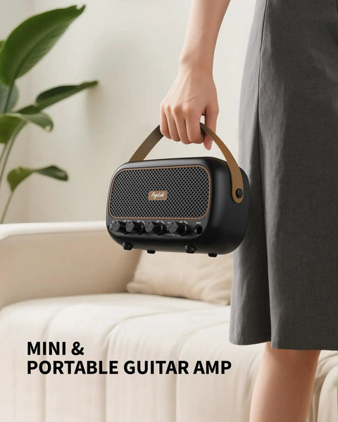 Compact 5W Per Channel Guitar Amp, Portable Battery Powered Practice Speaker With Bluetooth, beige handle, held by person.