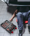 Mechanic using 132 Piece Home And Auto Repair Tool Set With Sturdy Toolbox Case Driver Handle Socket Wrench Hex Keys And Screwdriver Bits
