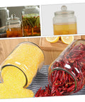 Level Up Your Pantry Setup With These Hella Tough 2 Liter Airtight Glass Tea Canisters And Food Storage Jar Set Built To Seal In Freshness For Coffee Beans Snacks And Grains While Keeping Counter Space Clean, showcasing jars with spices and grains.