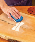 Person using mouse block from 2 Piece Sanding Block Set For 5 Inch Hook And Loop Discs Durable And Versatile For Softening Edges Detail Sanding