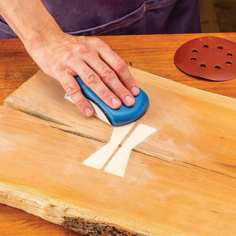Person using mouse block from 2 Piece Sanding Block Set For 5 Inch Hook And Loop Discs Durable And Versatile For Softening Edges Detail Sanding
