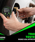 Front view of Rhino USA digital tire pressure gauge with glow dial and braided hose attached to a tire valve.