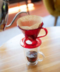 Unbleached Natural Brown Cone Coffee Filters Size Four For Eight To Twelve Cup Drip Coffeemakers With Flat Bottom Basket in use