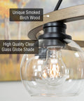 Close-up of Elwood 25-Inch 5-Light Industrial Rustic Wagon Wheel Chandelier With Clear Glass Globe Shades And Smoked Birch Finish