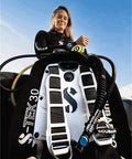 Diver preparing with Donut Wing For Technical Scuba Diving With 30 Lb Lift, Includes Inflator Hose And K-Style BPI, black.
