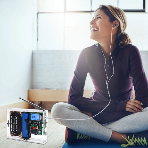 DIY FM Radio Kit 76 108 MHz With LCD Display and headphone jack used by woman in relaxed home setting