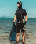 Diver holding 2 Pack Diving Snorkeling Mesh Drawstring Bags 29.5 x 10.8 Inches Black Gear Bags For Snorkel Fins And Dive Equipment Travel Backpacks