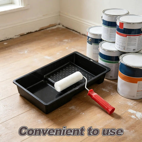 Slick Mini Paint Roller Kit With Tray For Walls Trim Doors And Metal on a floor with paint cans, showcasing convenience and compact design.