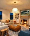 16" White and Gold Drum Pendant Light with Metal Lantern Fabric Shade illuminating a cozy living room with a fireplace.