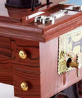 Close-up of Handcrafted Vintage Sewing Machine Music Box With Wind Up Mechanism Matte Ornament highlighting gear details.