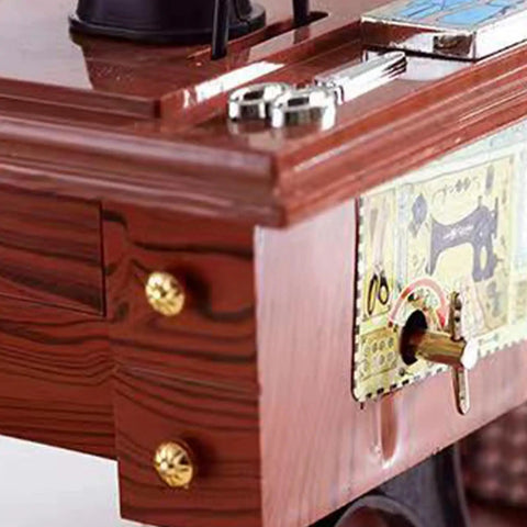 Close-up of Handcrafted Vintage Sewing Machine Music Box With Wind Up Mechanism Matte Ornament highlighting gear details.