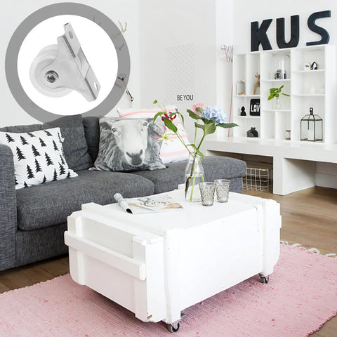 Ultra Silent 1 Inch PVC Swivel Caster Wheel for Furniture on a white coffee table in a cozy living room setting.