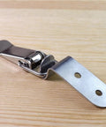 Sleek 20 PCS Stainless Steel Duck Mouth Buckle Hook Lock With Spring Loaded Draw Toggle Latch Clamp on wooden surface