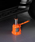 Orange VEVOR 20-ton hydraulic bottle jack under a car with a long 3-section handle