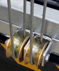 Close-up of pulleys with steel cables on Beefy Electric Scaffolding Lift Platform Heavy Duty Galvanized Steel Mobile Aerial Work Cart.