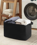 95L Extra Large Blanket Basket For Living Room And Nursery 24 By 16.9 By 14.2 Inch Woven Storage Bin in black with towels