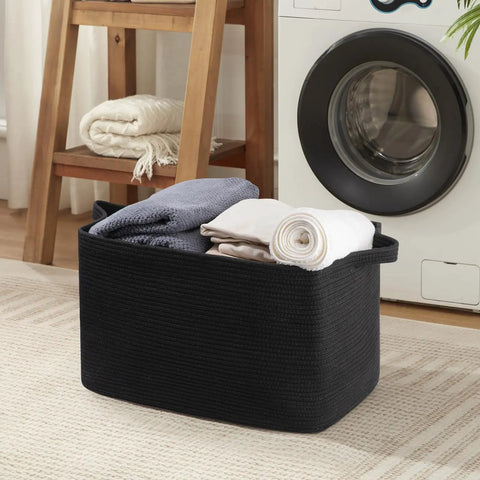 95L Extra Large Blanket Basket For Living Room And Nursery 24 By 16.9 By 14.2 Inch Woven Storage Bin in black with towels